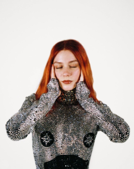 DJ group member Rebequita Libertad posing Cosi Tutti